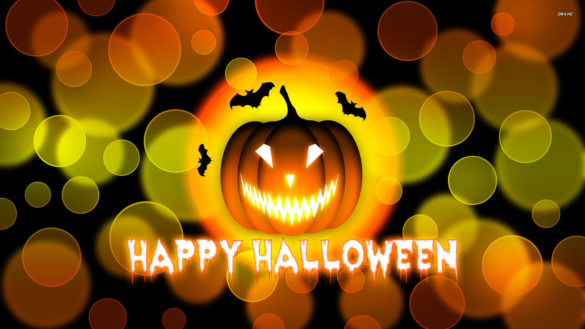 A glowing jack-o'-lantern with bats against a backdrop of blurred orange and yellow lights, wishing a 'Happy Halloween'