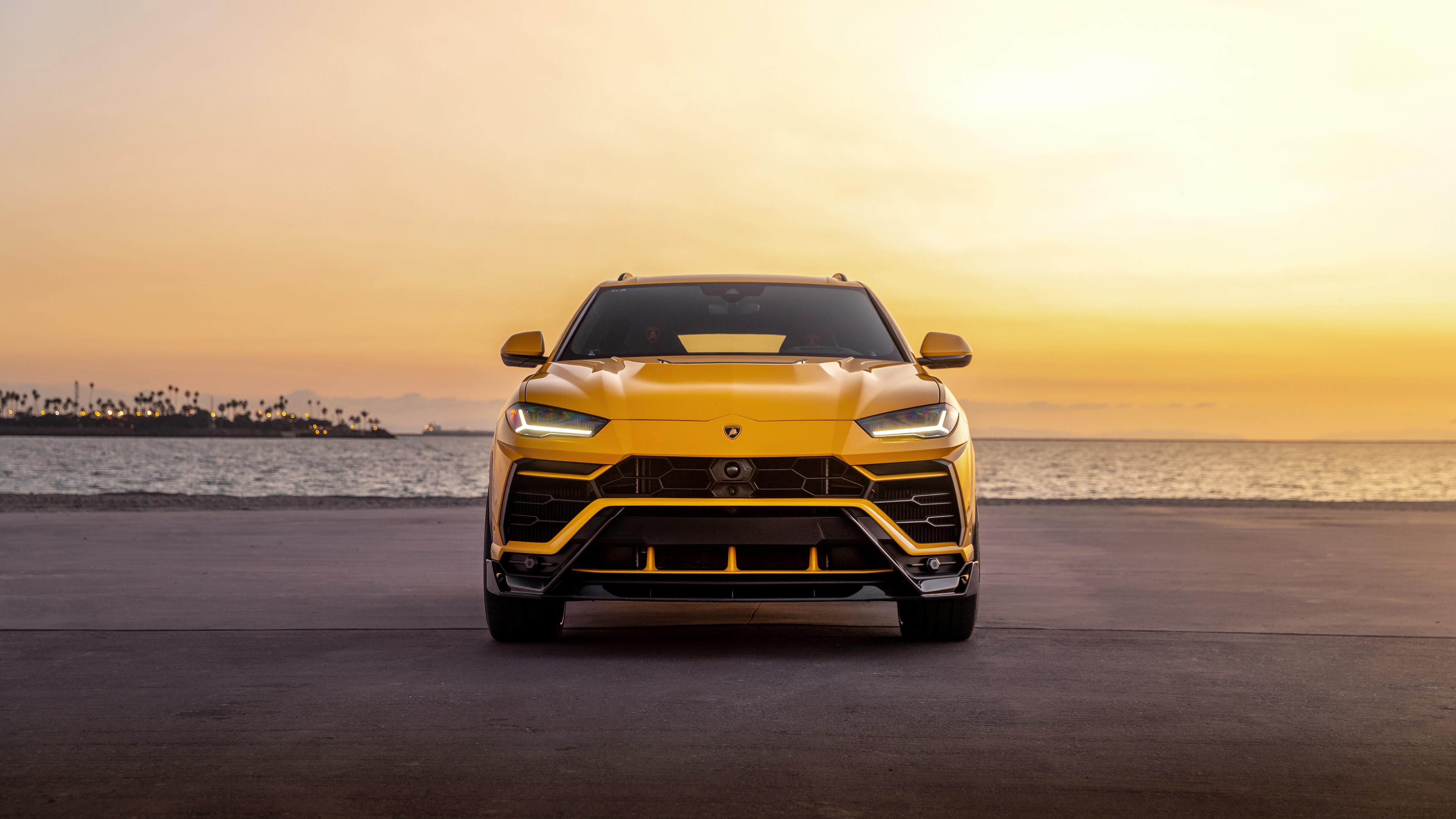 Yellow Lamborghini Urus Suv Near The Water Desktop Wallpaper