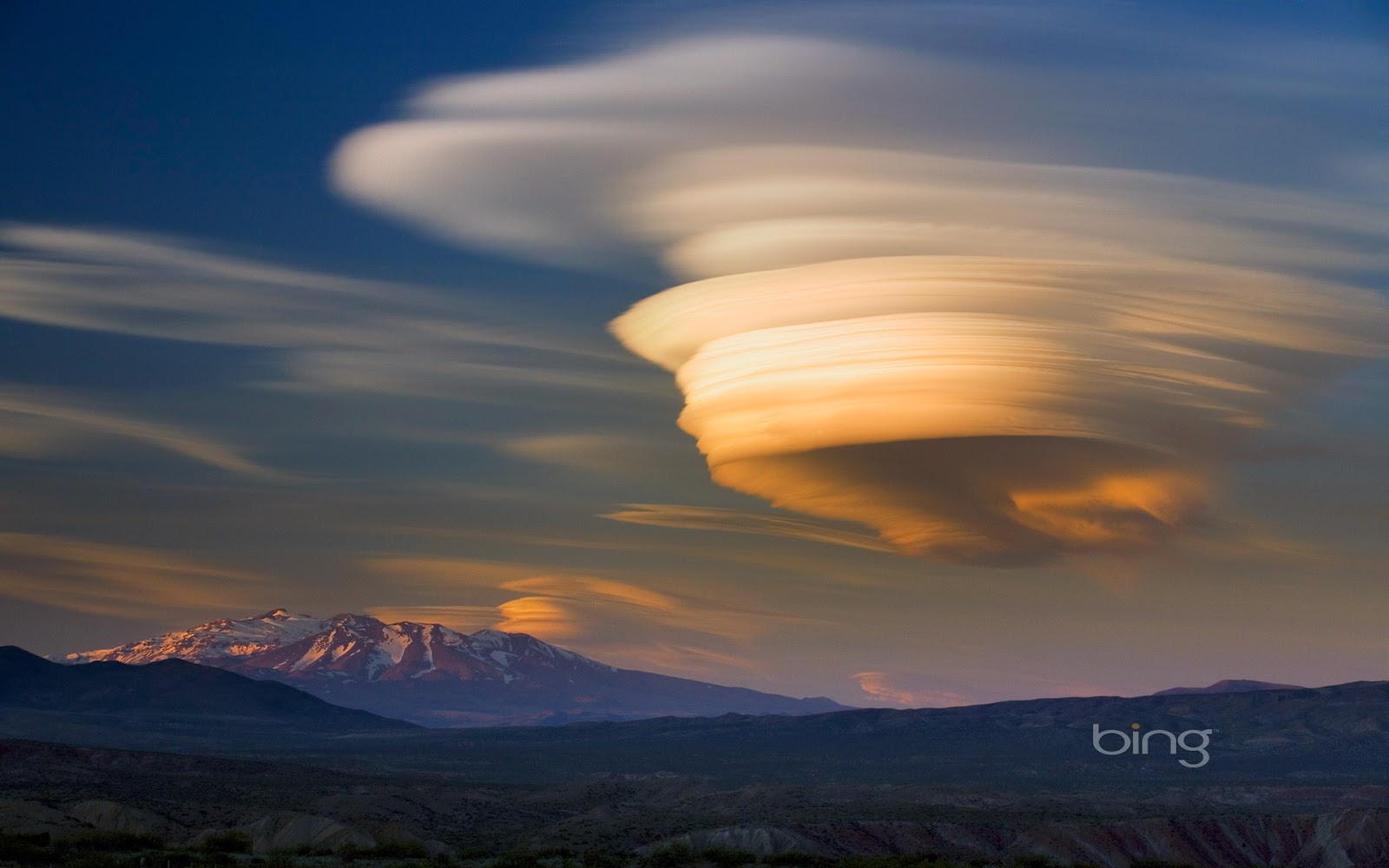 Lenticular cloud over extinct volcano at sunset Patagonia Argentina 1600x1000