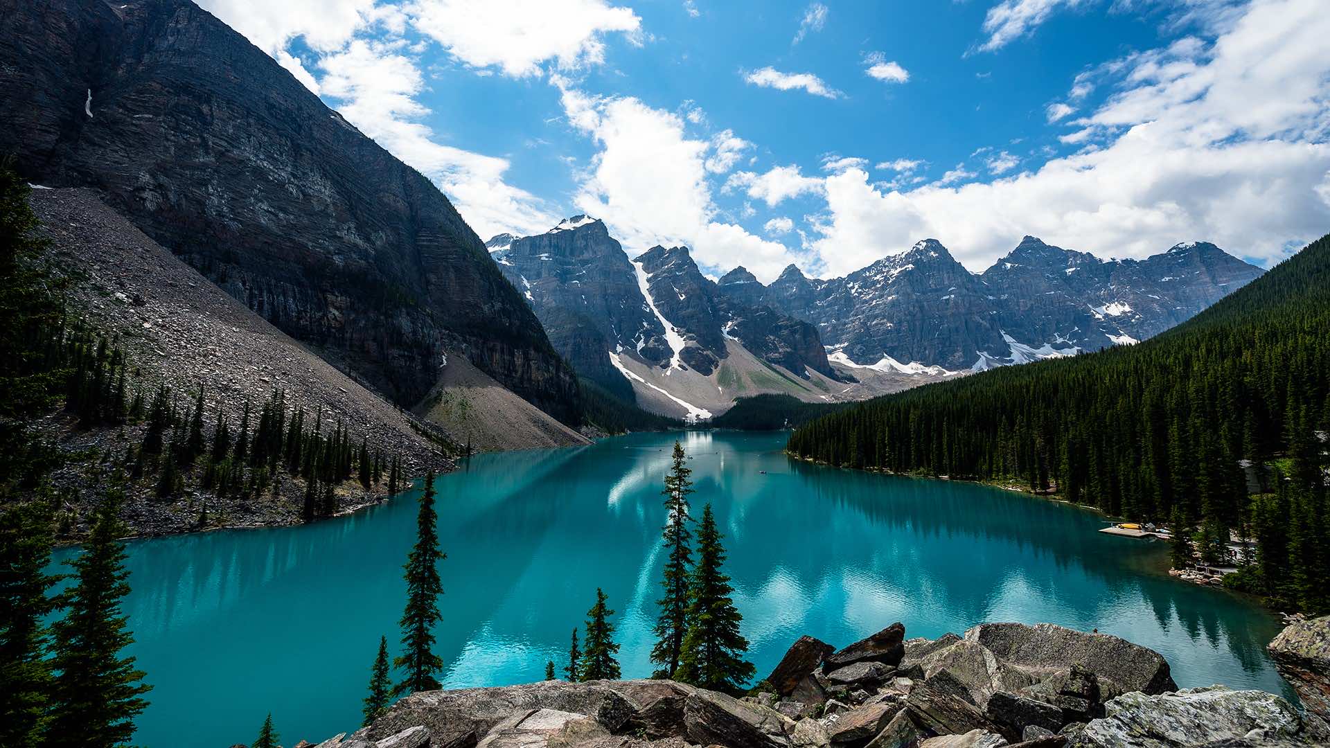 Stunning turquoise lake nestled amidst snow-capped Canadian Rockies, perfect for desktop wallpaper