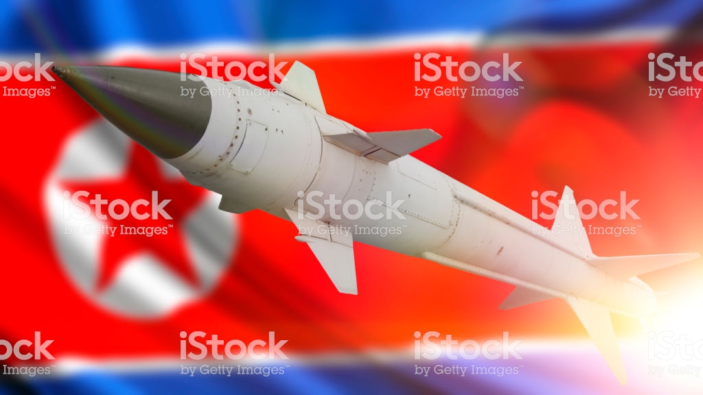 A Missile With Warhead Against The Background Of Flag