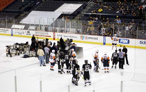 Players Watch As A Hockey Scene Is Rehearsed Tuesday At Mellon Arena