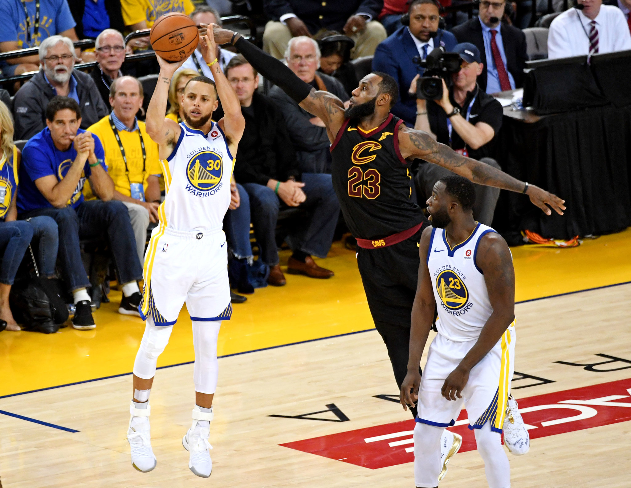 Stephen Curry of the Golden State Warriors shoots a jump shot over LeBron James of the Cleveland Cavaliers during the 2018 NBA Finals