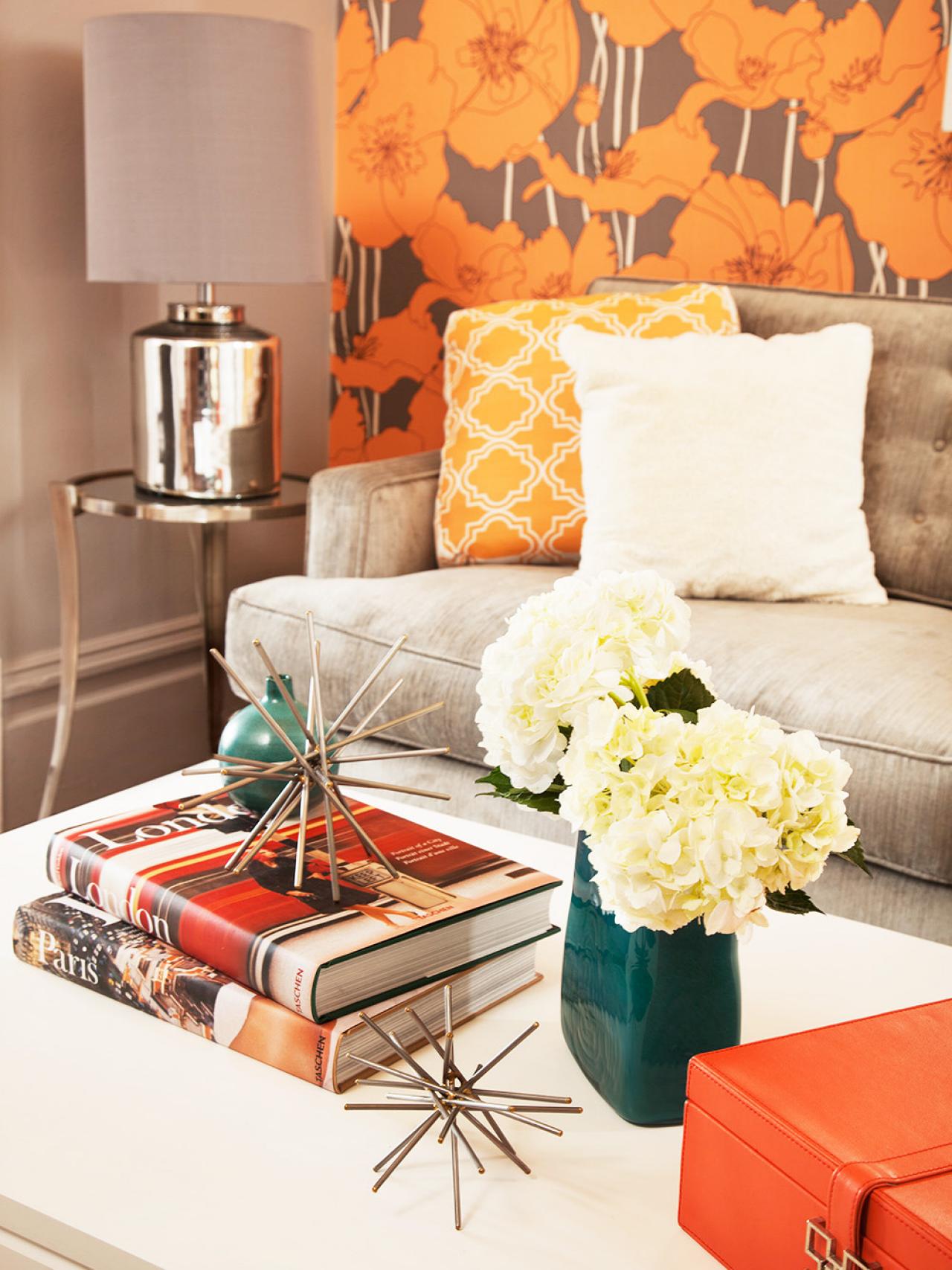 Modern Orange and Brown Living Room With White Coffee Table HGTV