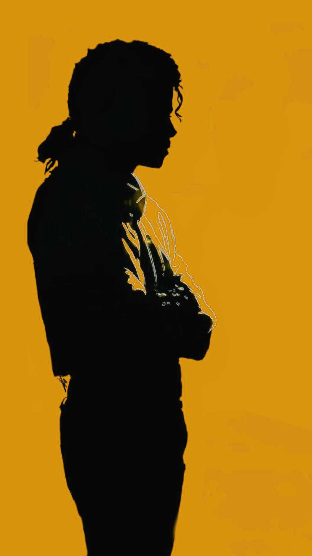 Silhouette of Michael Jackson against a gold background