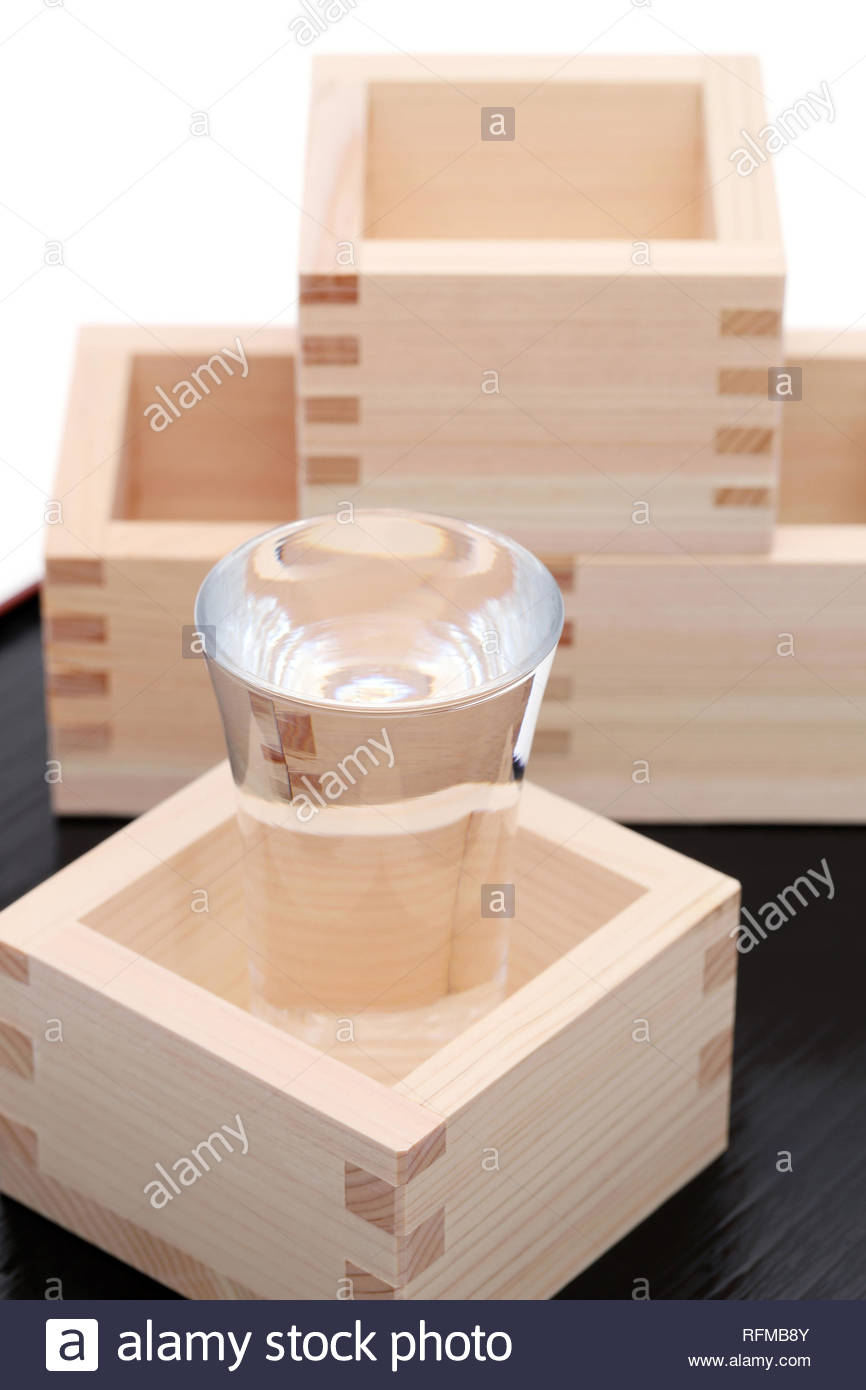 Japanese Wooden Box Masu With Sake On A Table Background