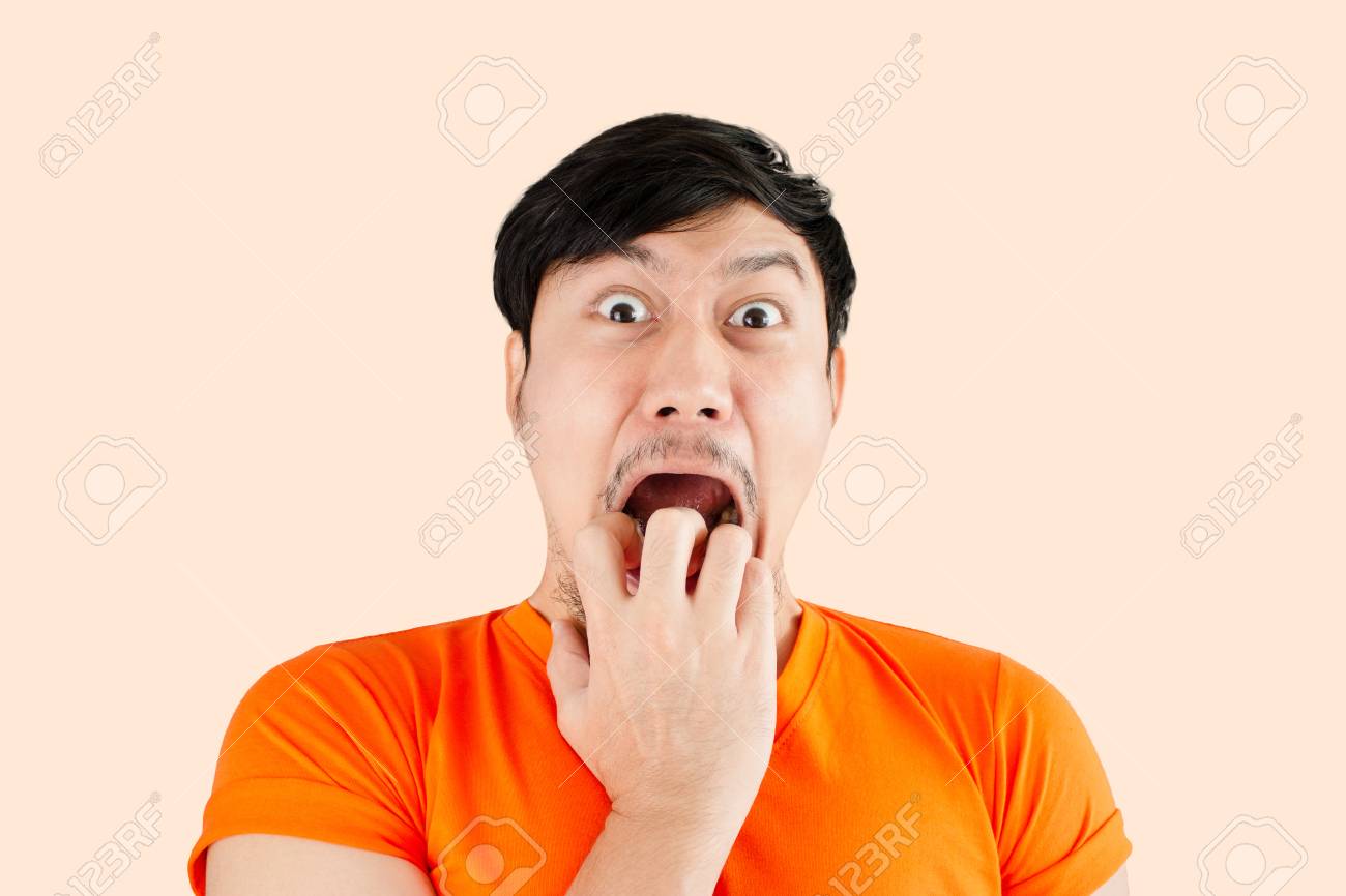 Surprised And Shocked Face Of Asian Man On Isolated Background