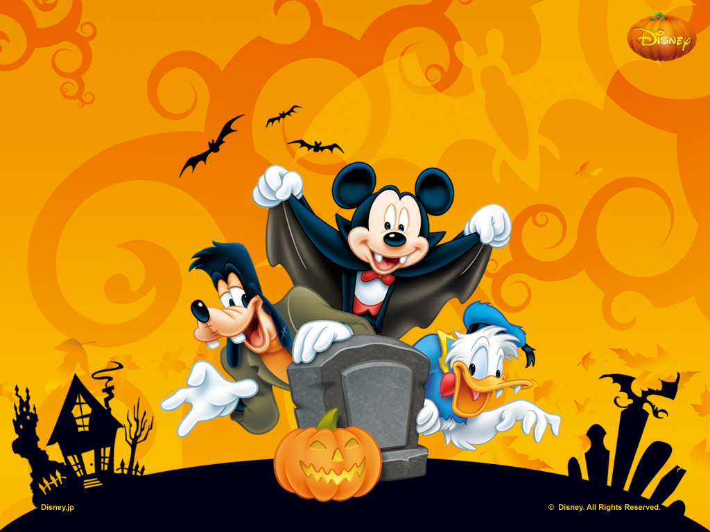 Mickey Mouse, Donald Duck, and Goofy celebrate Halloween in this fun and festive wallpaper. Mickey is dressed as a vampire bat, Donald as a duck in Halloween colors, and Goofy in his classic attire, posing with a tombstone and a grinning jack-o'-lantern. Bats, a spooky house, and more Halloween elements complete the scene