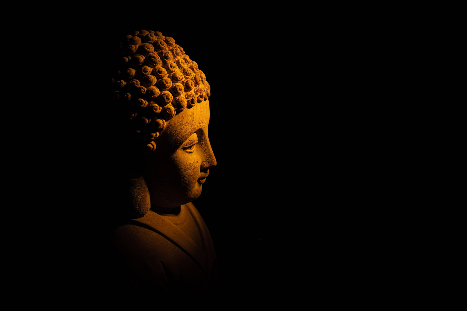 Serene Buddha Statue in Soft Light: A Peaceful Buddhist Image