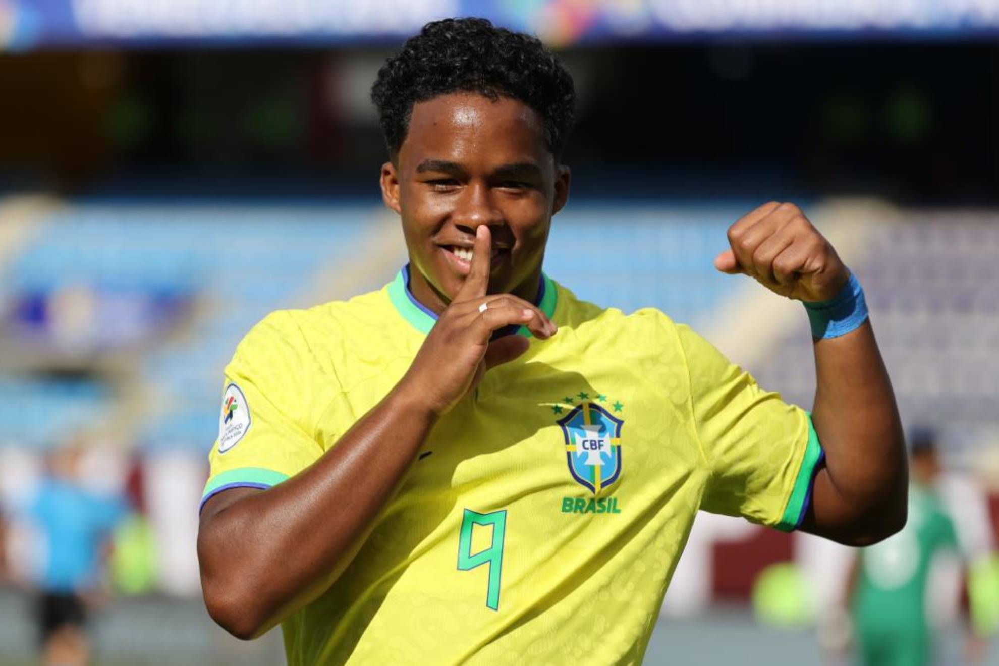Endrick Felipe celebrates a goal for Brazil, with his finger to his lips in a 