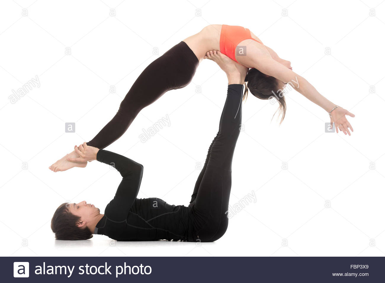Sporty Couple On White Background Doing Acroyoga Fitness Or