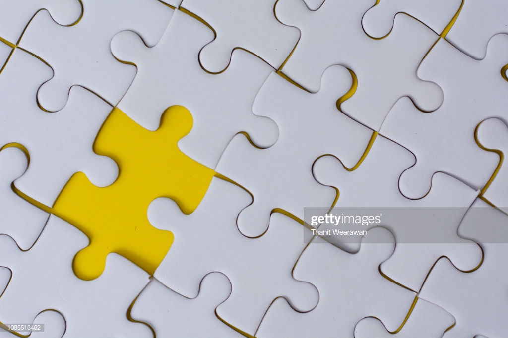 White Jigsaw Puzzle On Yellow Color Background Stock Photo Getty