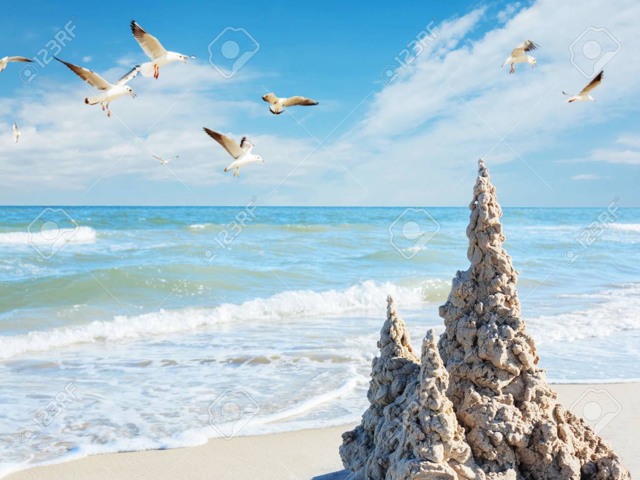 Sand Castle On Beach On Sea Seagull Background Stock Photo 1300x975