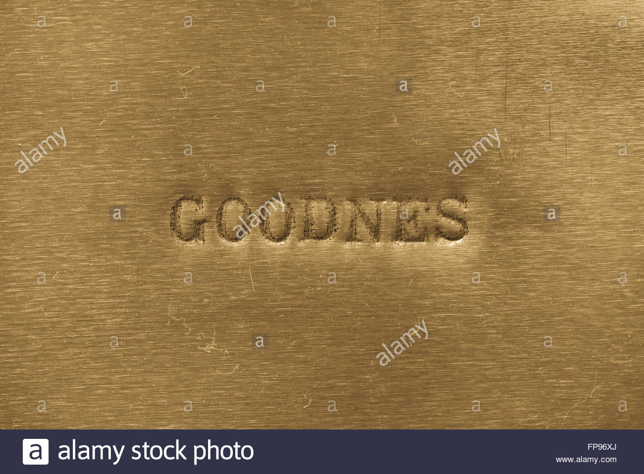 Word Goodness Printed On Golden Metallic Background Stock Photo