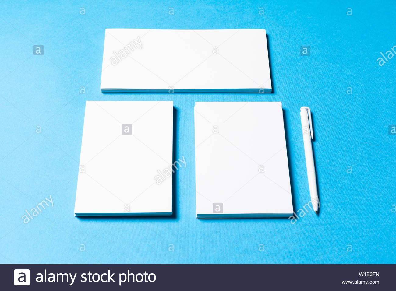 Blank Office Objects Organized For Pany Presentation On Blue