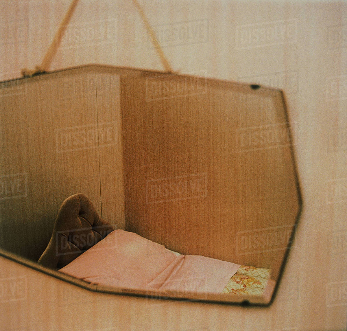 Right Angled Mirror With Bed Reflection On Pink Wallpaper Stock