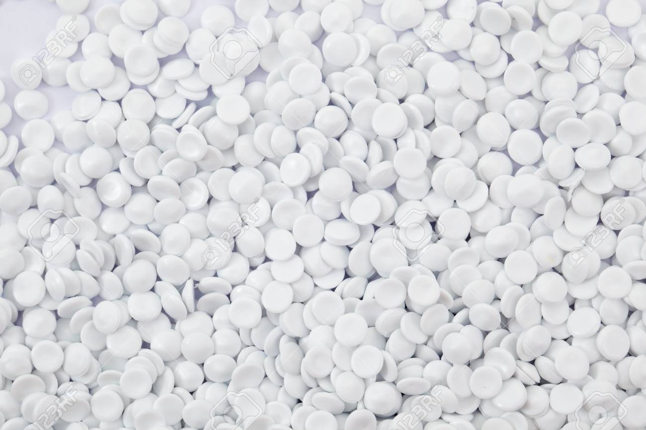 Background Of White Industrial Polymer Granules Stock Photo