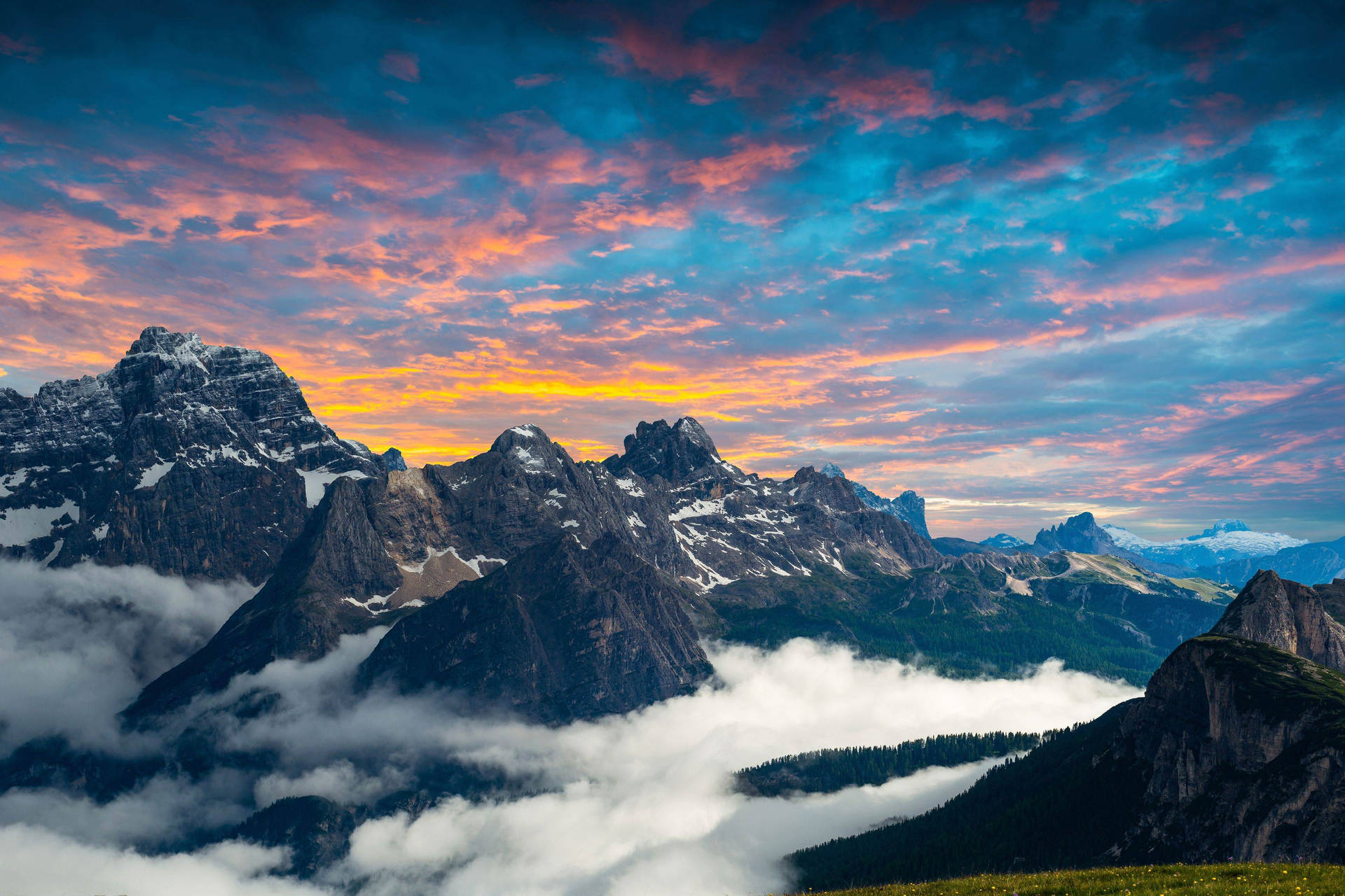 Majestic Mountain Peaks at Sunset with Clouds