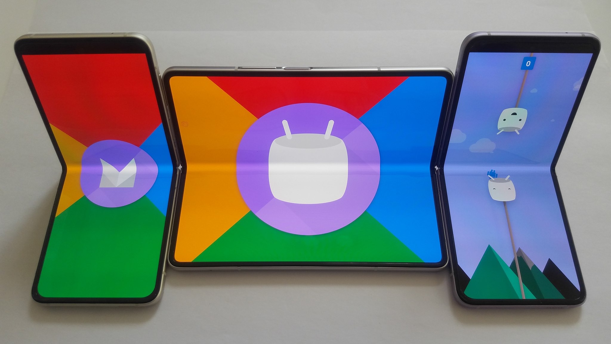 Three Google Pixel Foldable Phones showcasing Google branding and Android Marshmallow Easter egg game