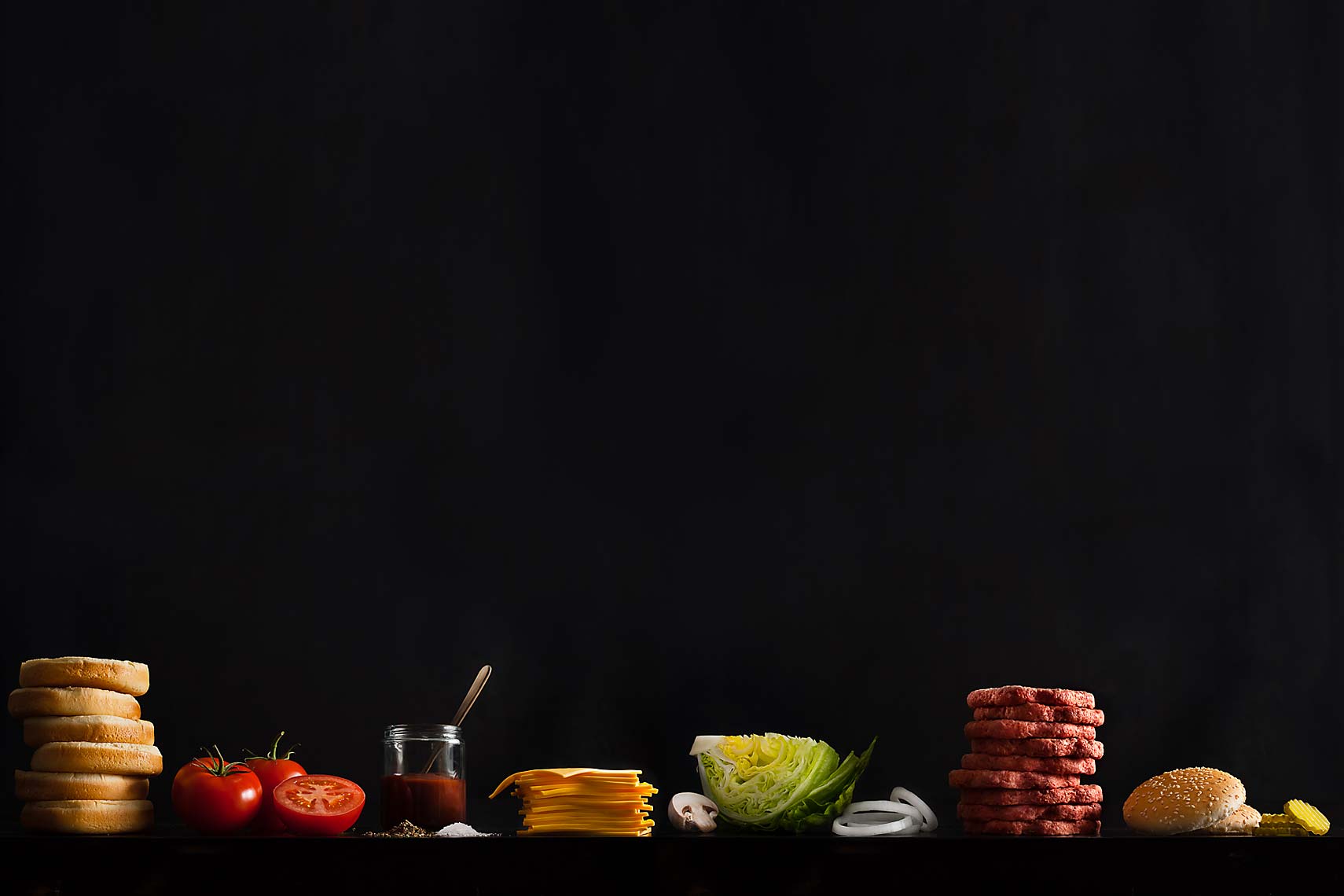 Burger King Raw Ingredients Lined Up On A Dark Background