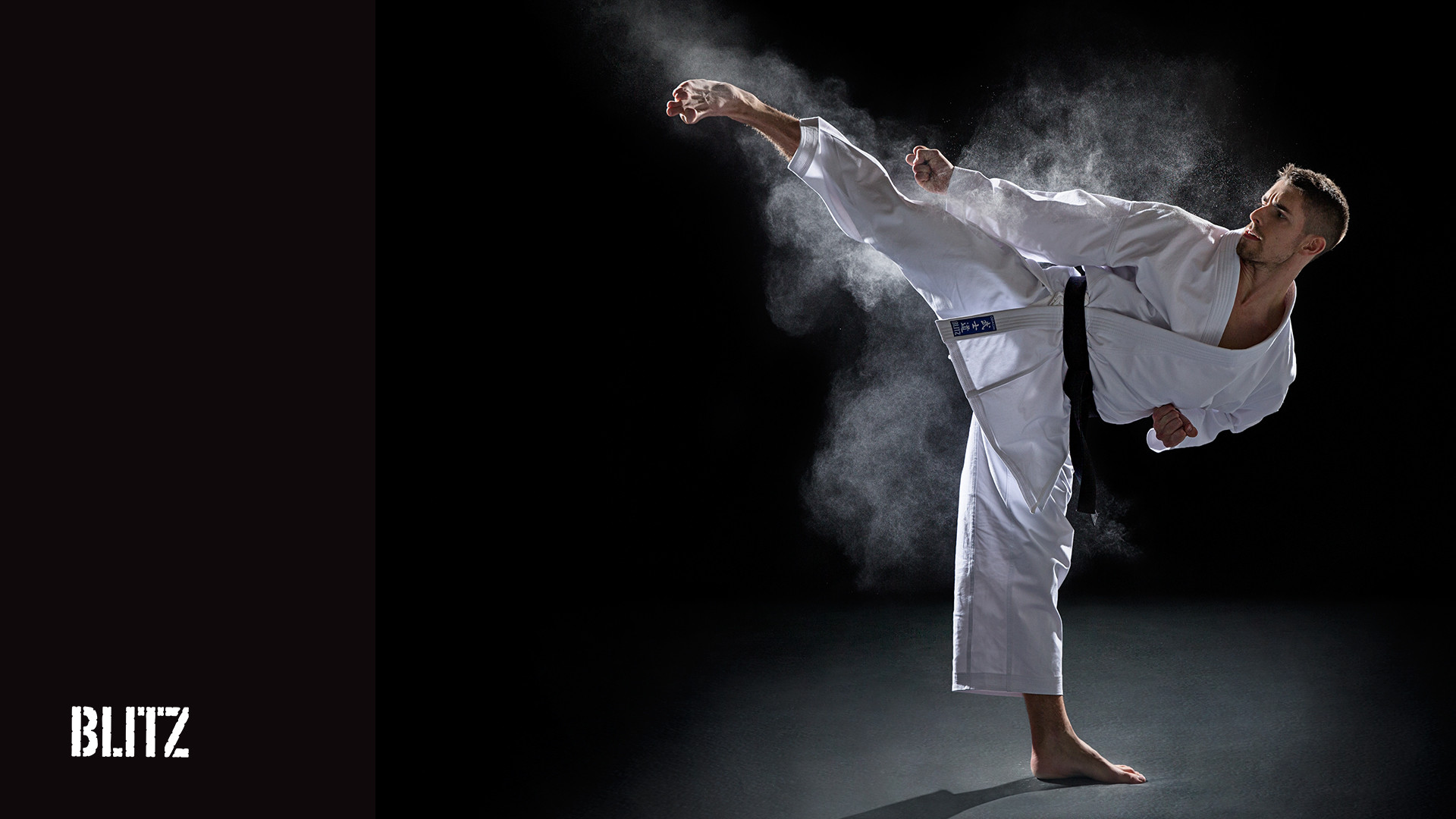 A karateka executing a powerful high kick in a dynamic pose, with a cloud of dust emphasizing the impact