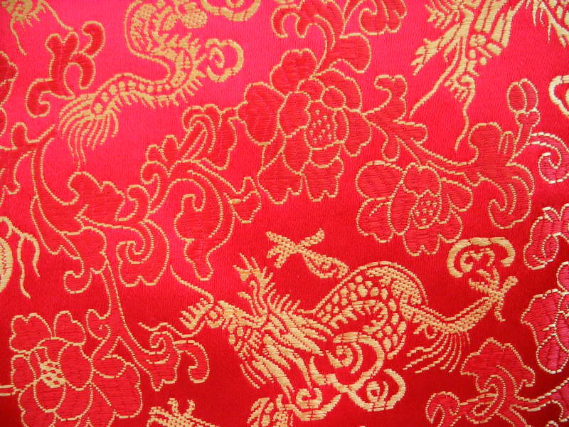 Brilliant red background with metallic gold dragons and flowers Code