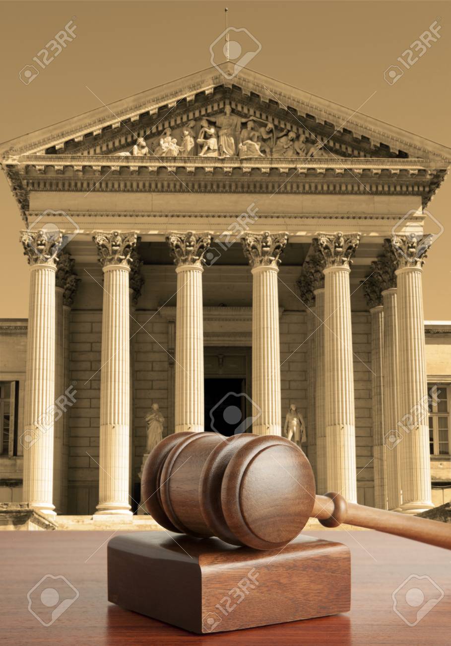 Gavel Against The Background Of Courthouse Stock Photo
