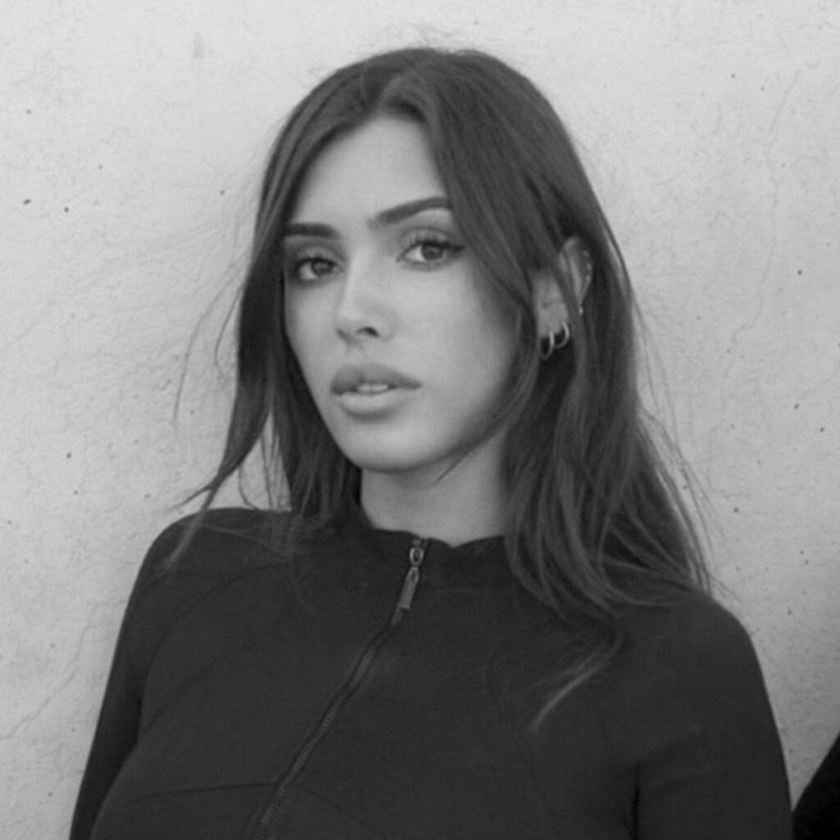 Black and white portrait of Bianca Censori, an Australian architect and designer