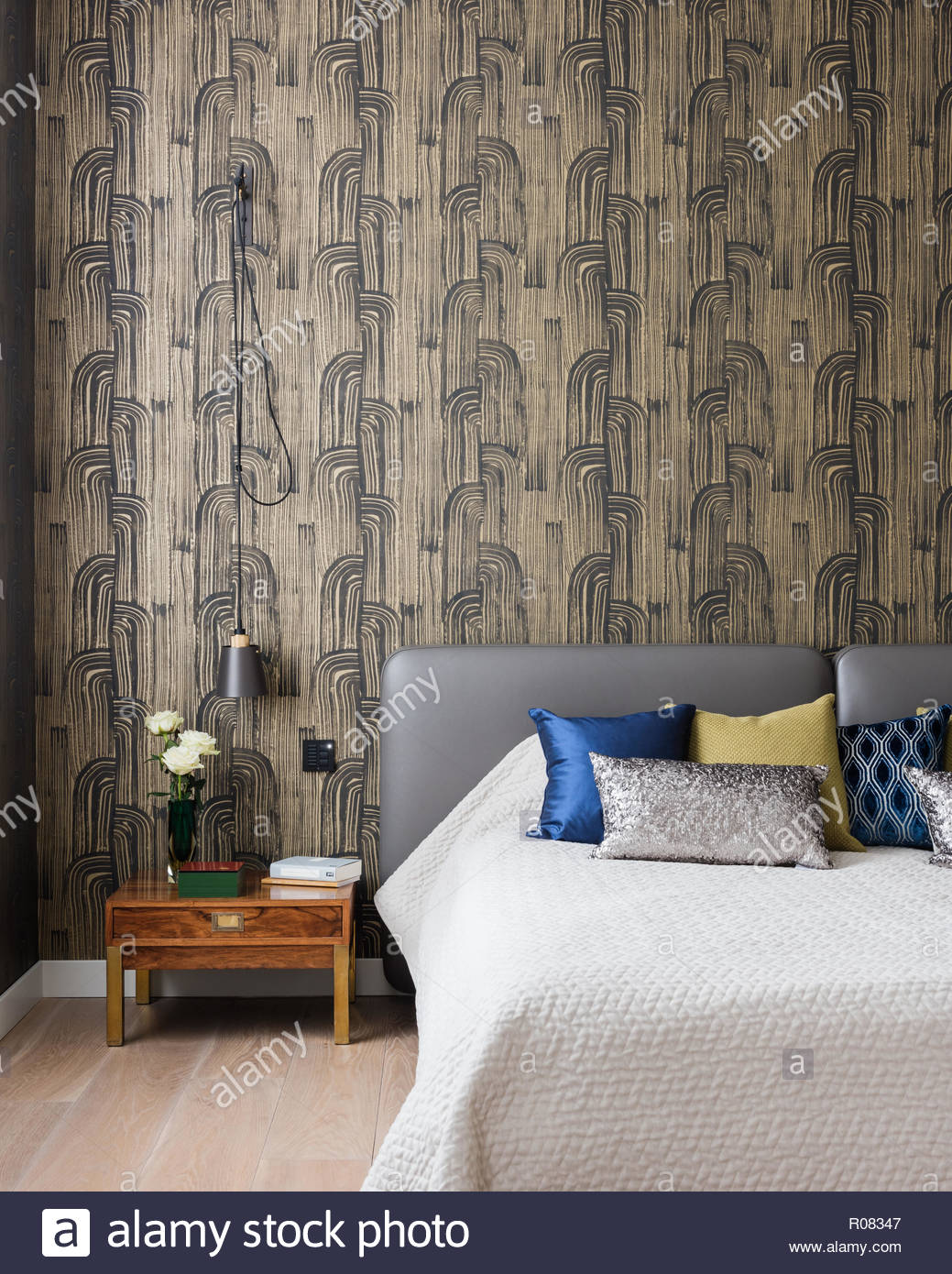 Modern Bedroom With Patterned Wallpaper Stock Photo