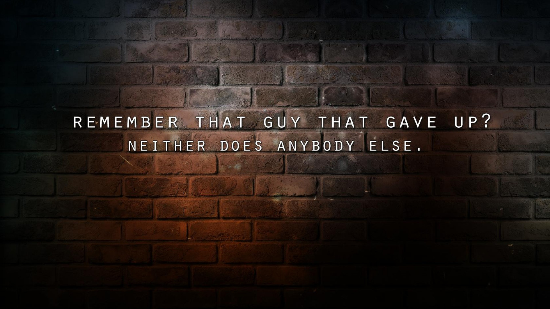 Motivational quote on a brick wall background: 