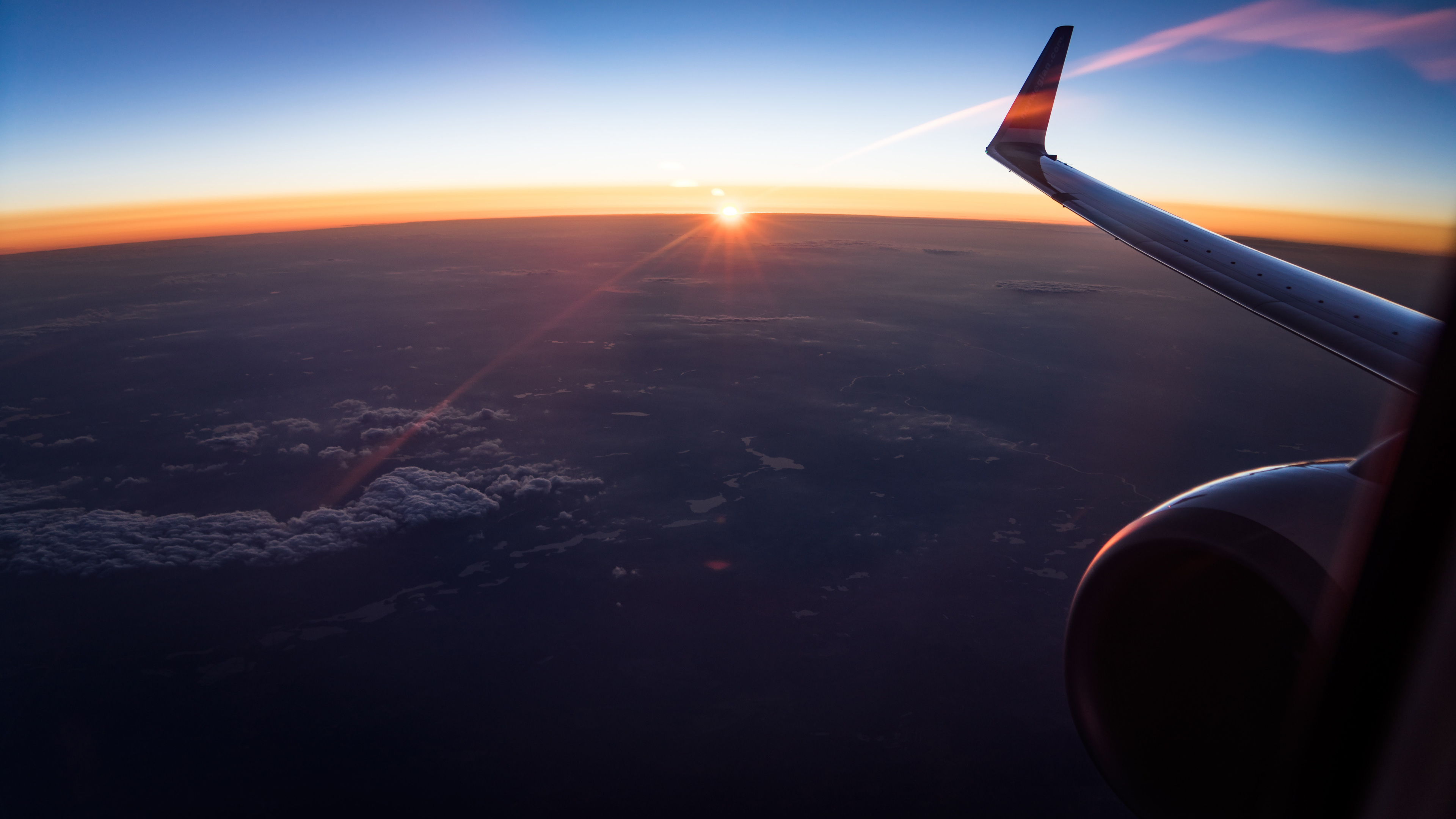 Aerial Of White Clouds During Sunset Outside Airplane 4k Wallpaper
