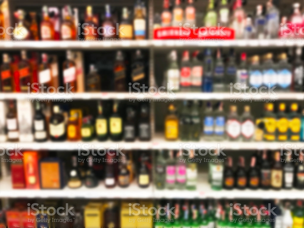 Free download Wine Liquor Bottle On Shelf Blurred Background Stock