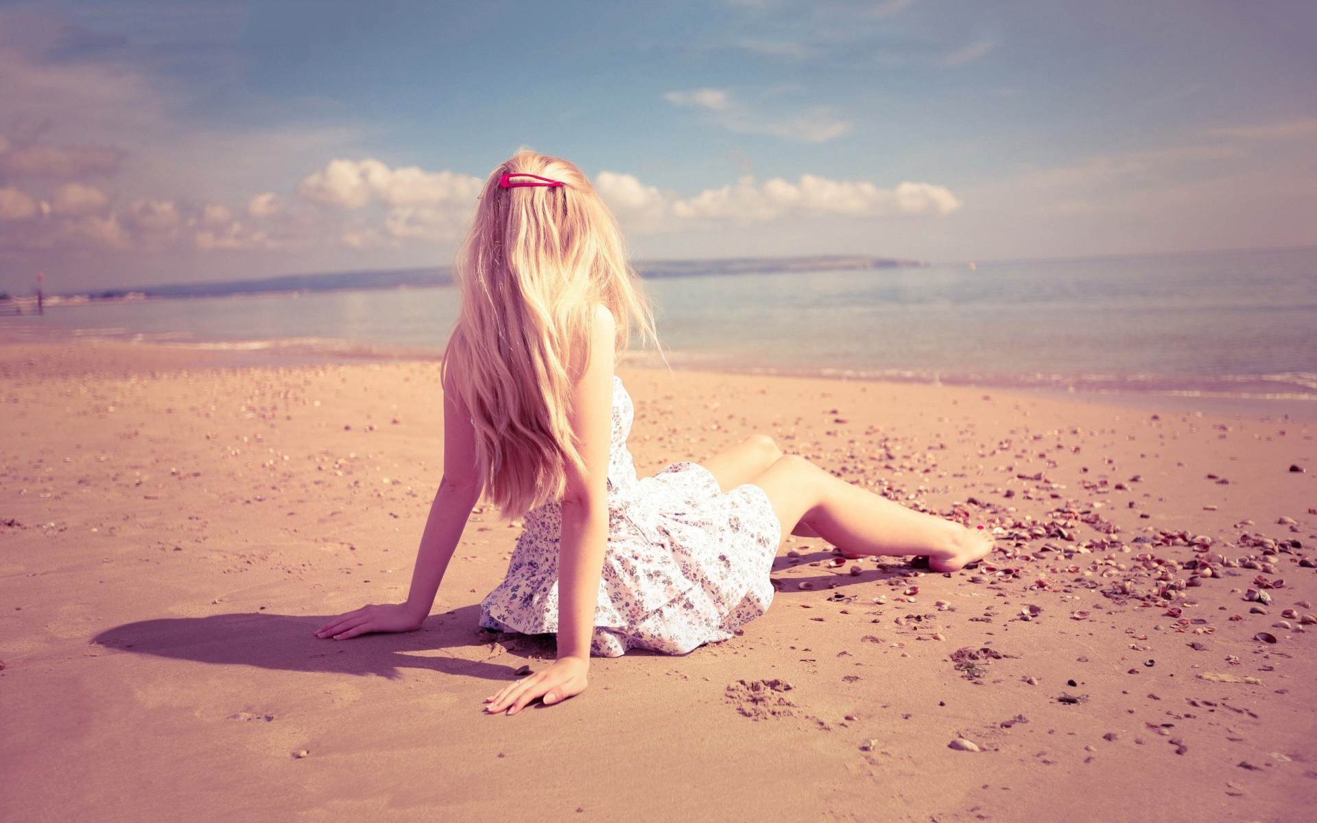 Lonely Girl Sitting On Beach