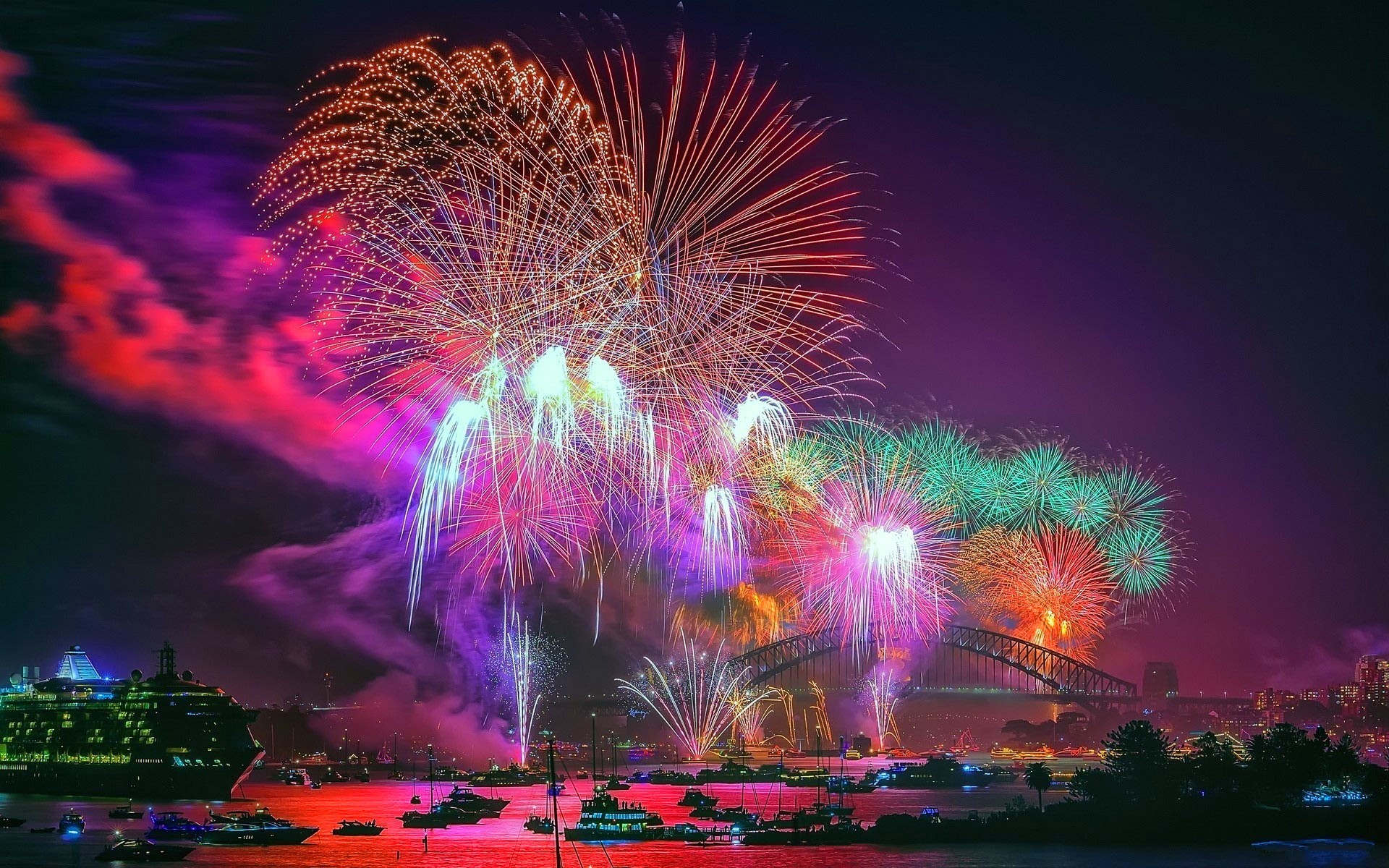 Fireworks light up the night sky over Sydney Harbour Bridge during a New Year's celebration