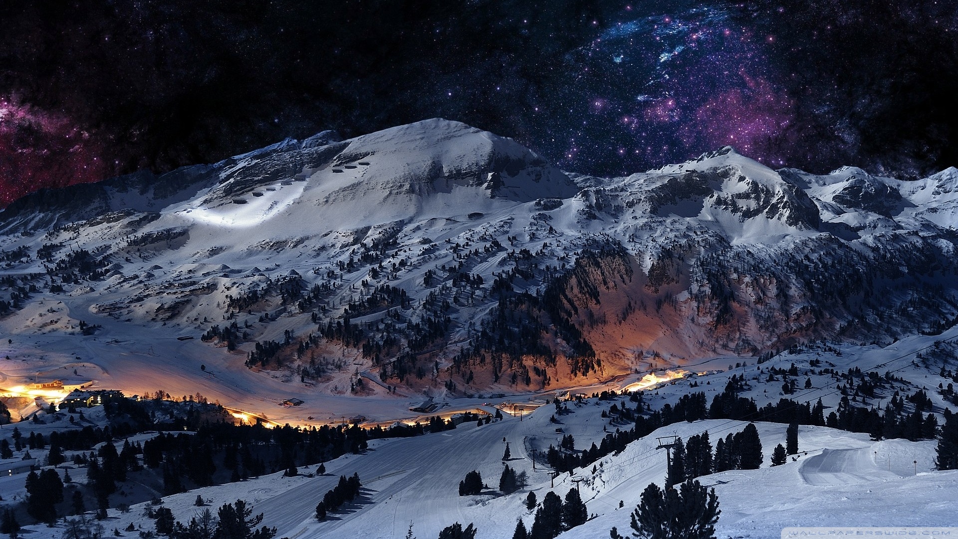 Snowy mountains at night under a starry sky