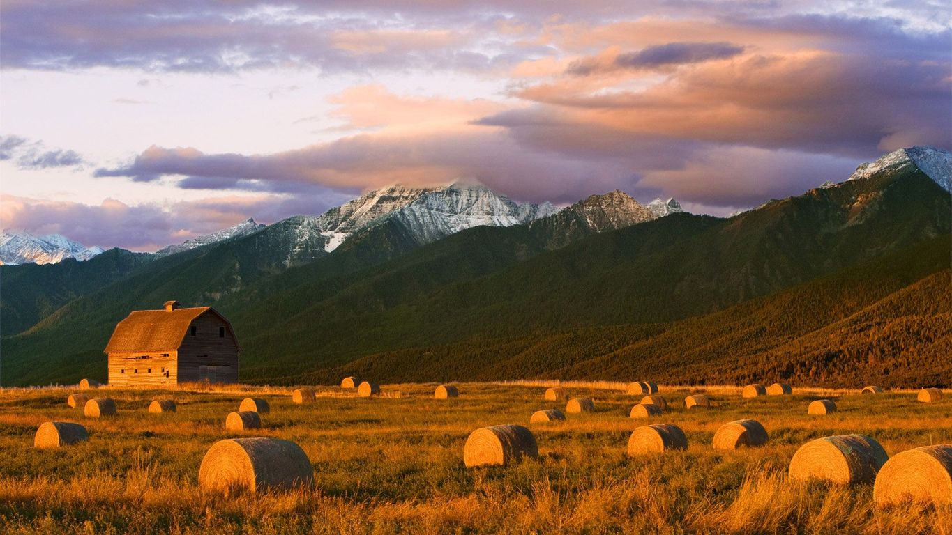Barn And Hay Bales In The Mission Mountains Wallpaper