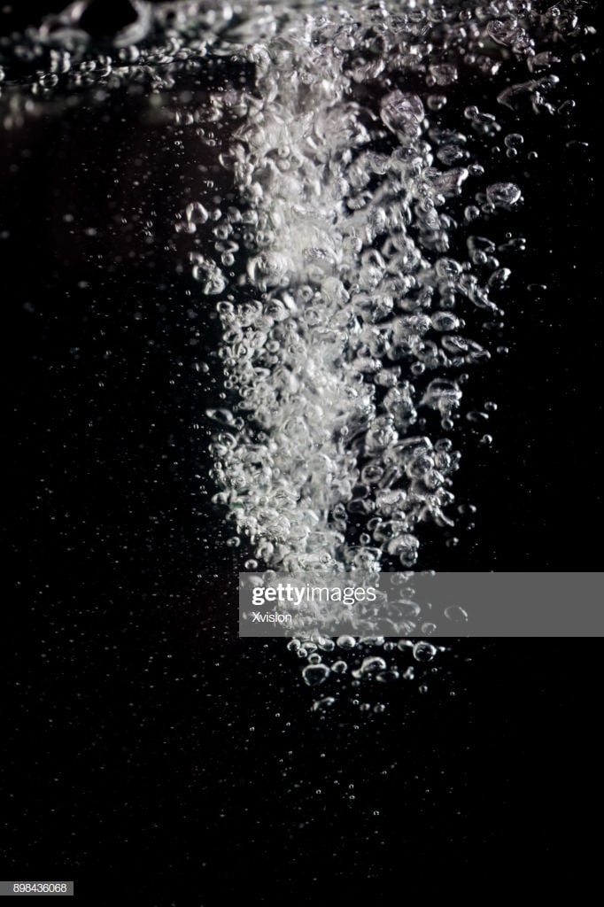Air Bubble In The Water In Crash With Black Background Studio Shot