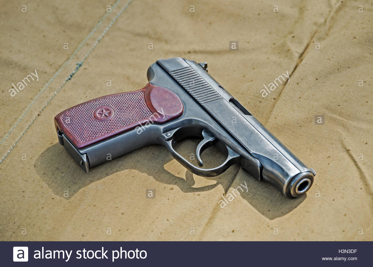 Pistol 9mm Pm Makarov On Background Army Tarpaulin S Stock