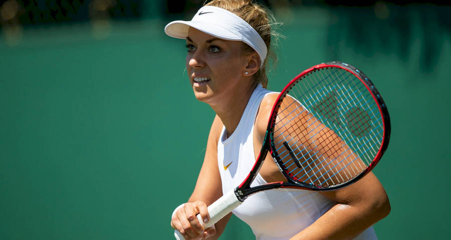 Professional Tennis Player Sabine Lisicki On The Court Wallpaper