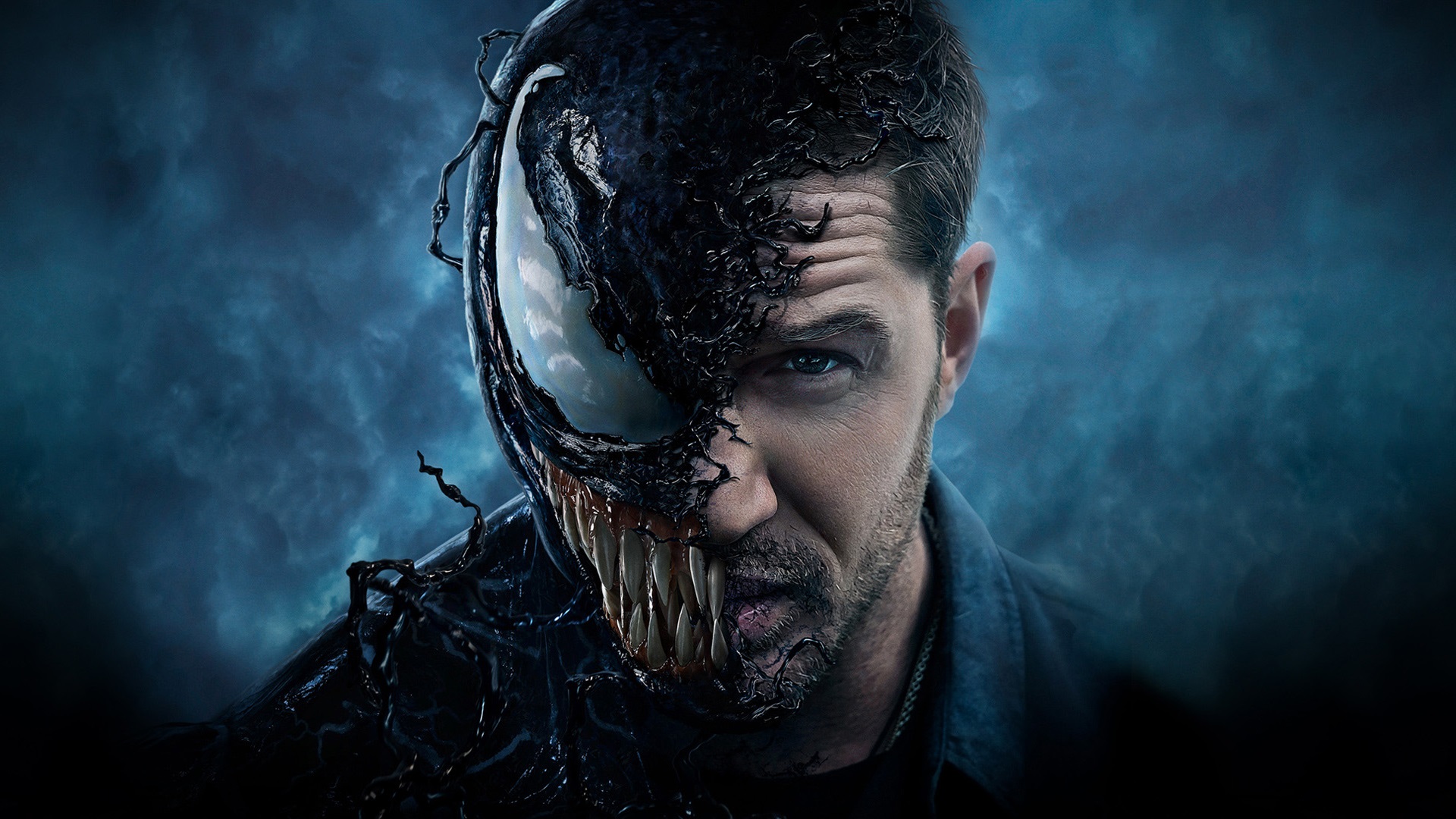 Venom, the Marvel anti-hero, partially covering the face of Eddie Brock, against a dark blue background
