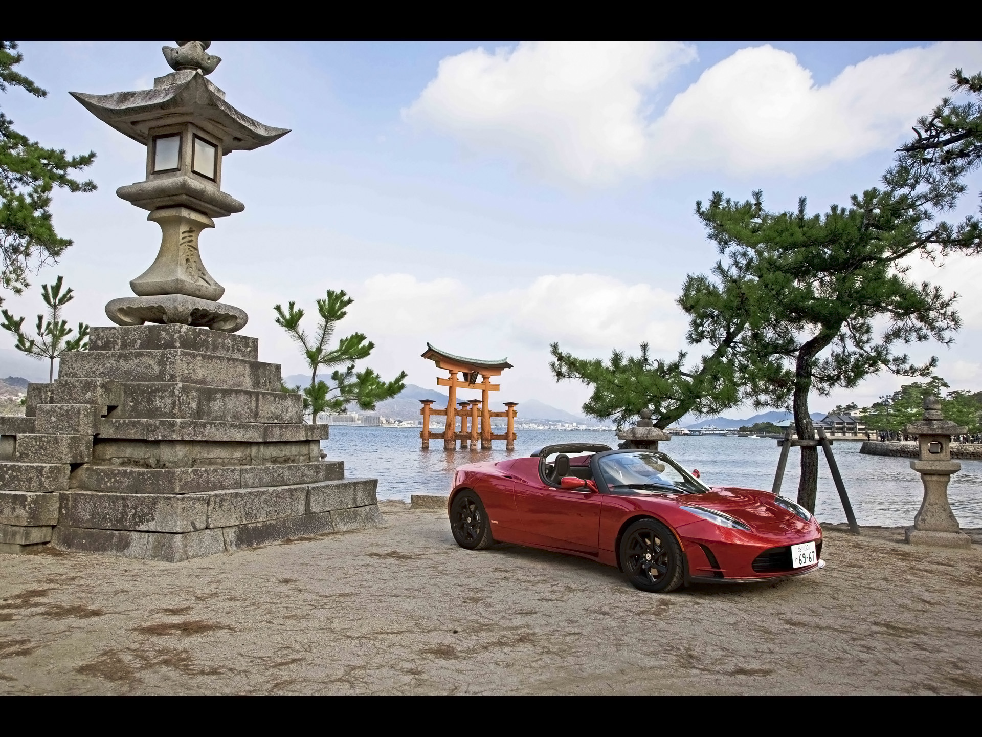 Red Tesla Roadster In Japan Front And Side Angle desktop wallpaper