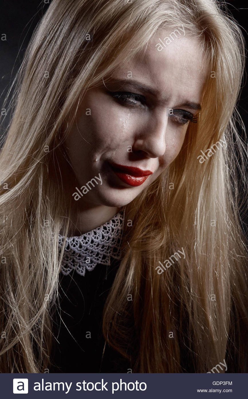 Sad Girl Crying On Black Background Stock Photo