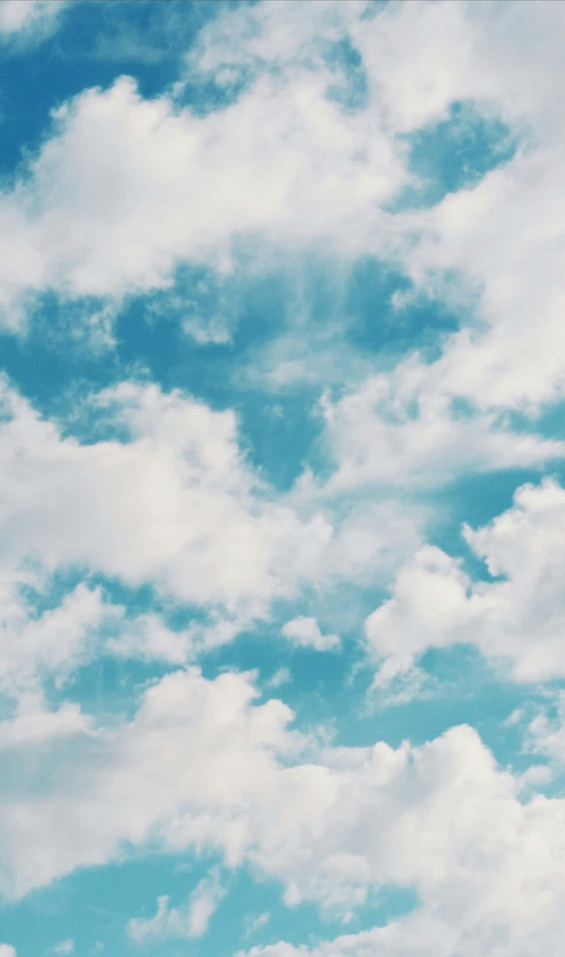 A Perfect Day At The Beach With Beautiful Blue Sky Wallpaper