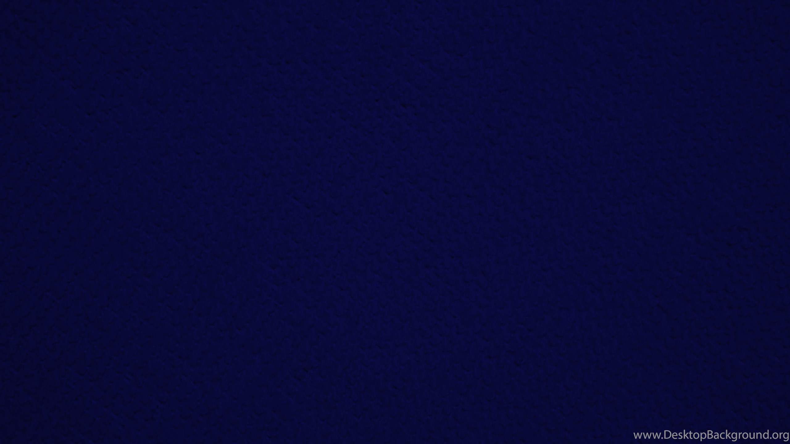 A solid, textured navy blue background