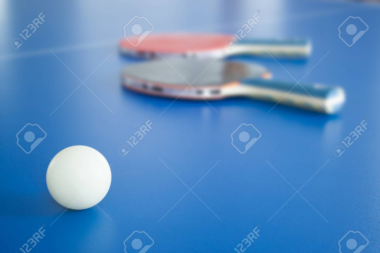 White Ping Pong Ball With Rackets On Background Table Tennis