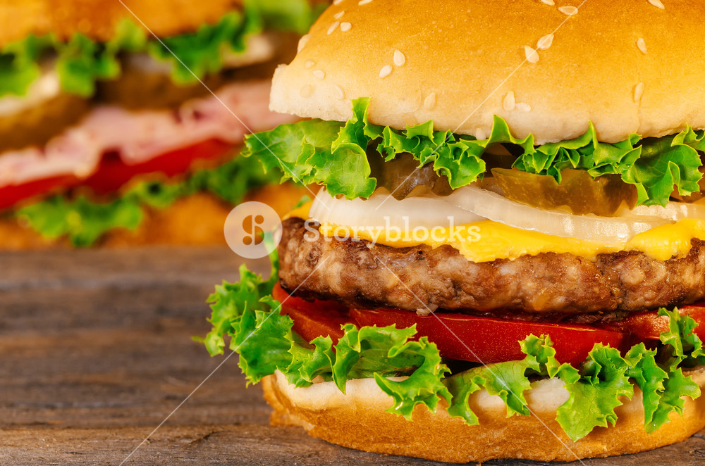 Closeup Of Home Made Burgers On Wooden Background Cheeseburger