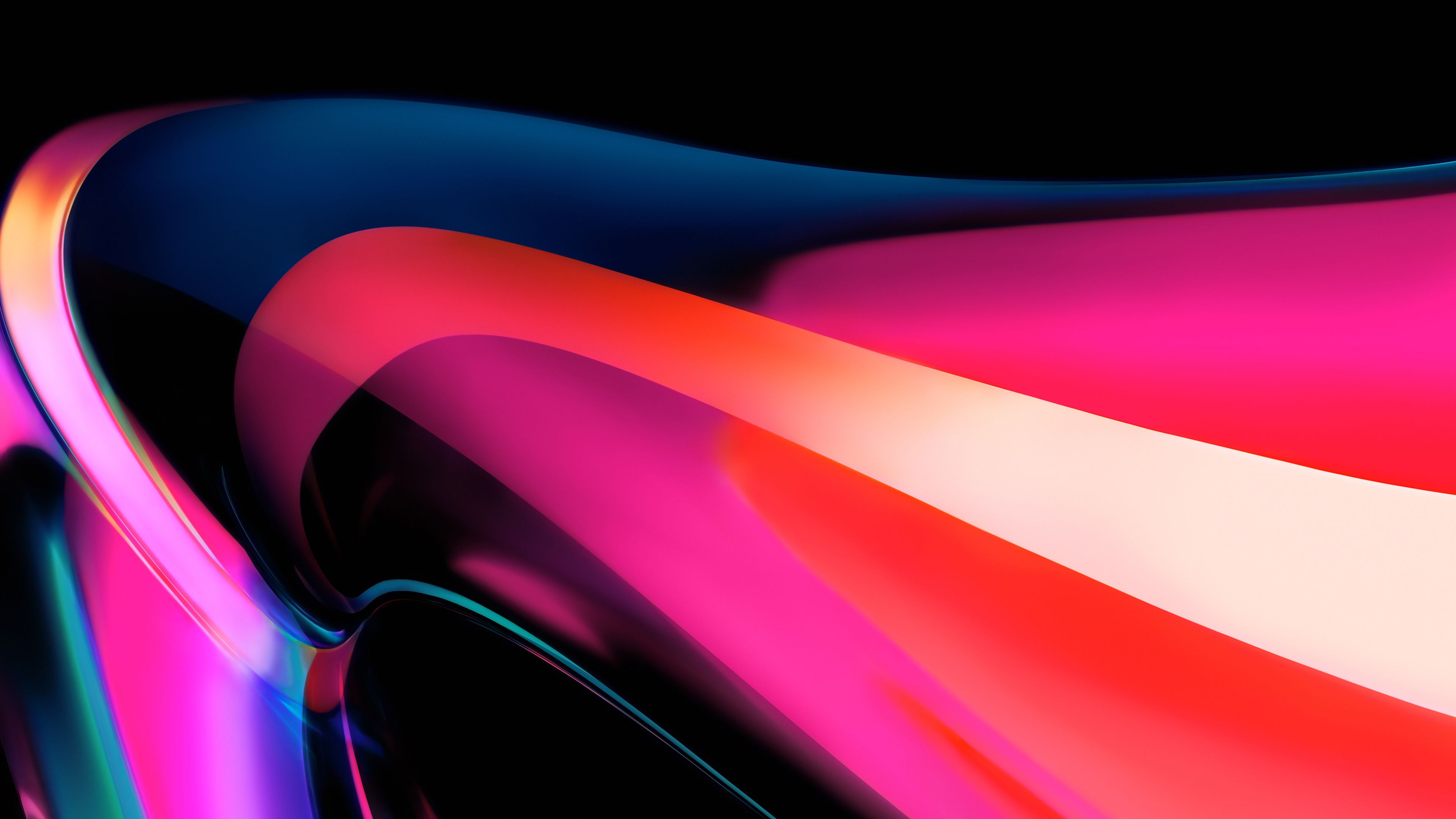 Abstract MacBook wallpaper with vibrant pink, red, and blue hues, creating a fluid and dynamic design