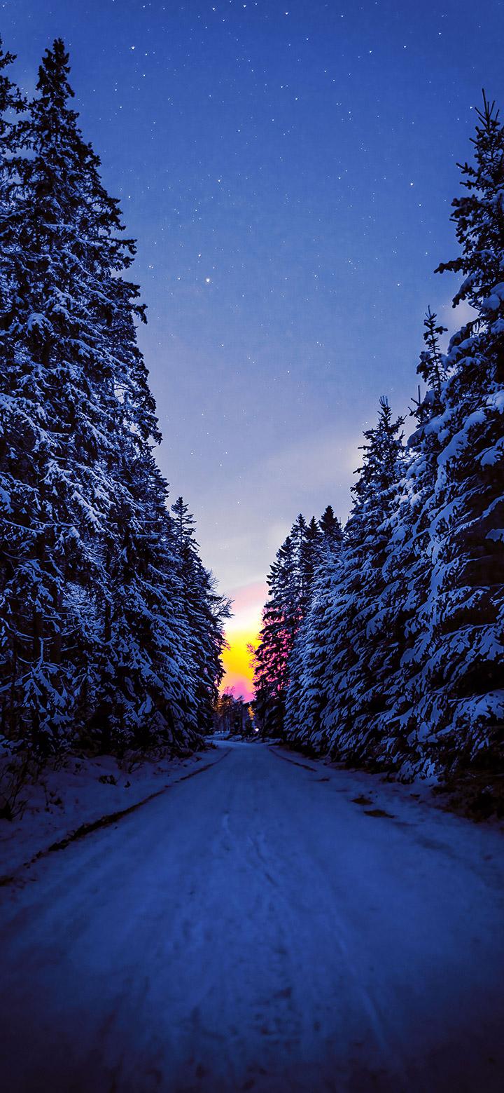 Dark Road Covered With Snow During Winter 4K Phone Wallpaper