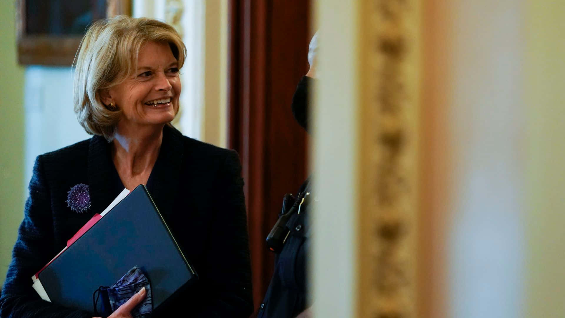 Lisa Murkowski Smiling Holding Documents Wallpaper