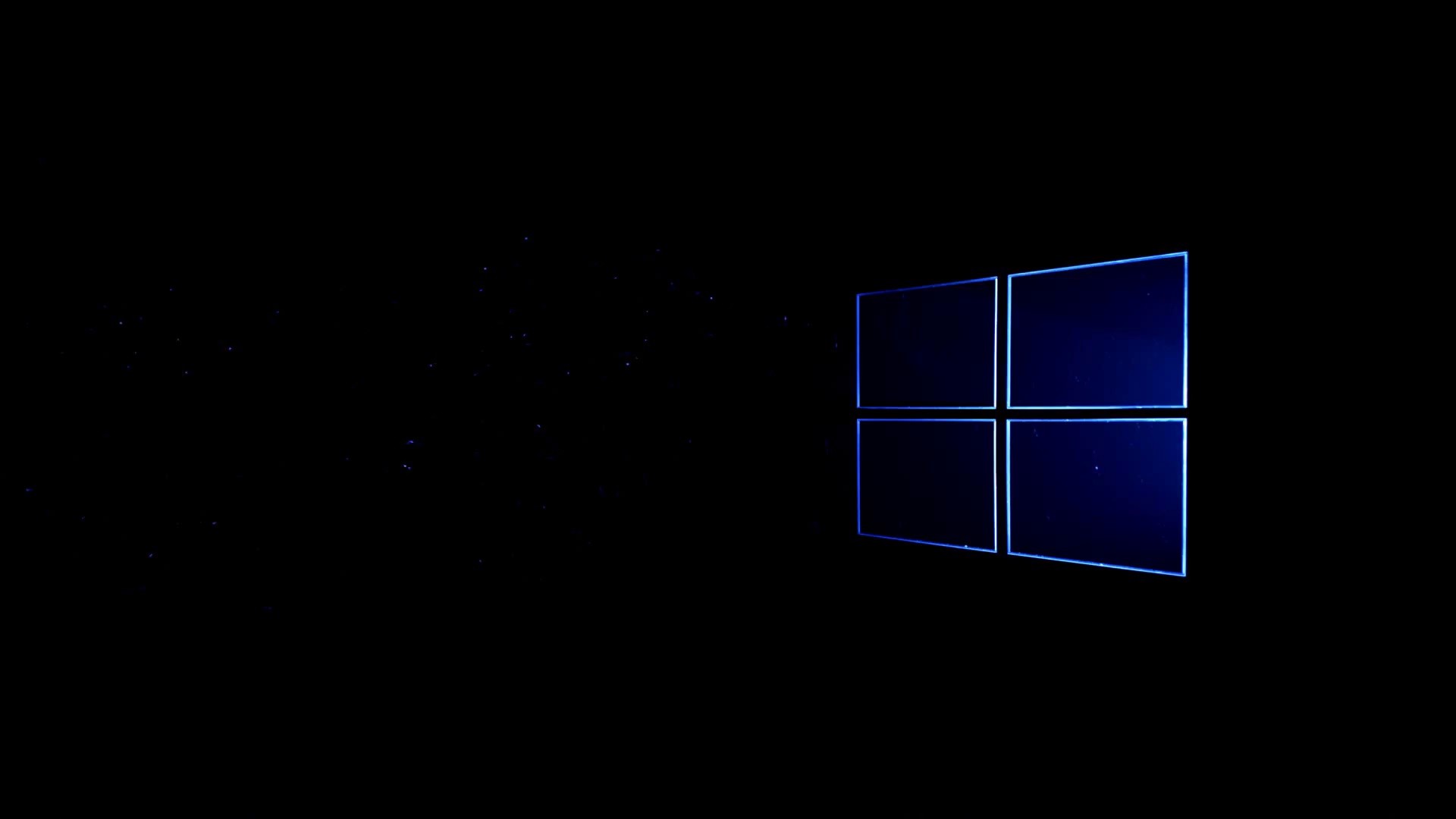 Dark background with a dimly lit Windows logo, suitable for a minimalist Windows wallpaper